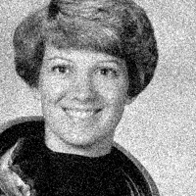 Slider comparing a grainy grayscale astronaut face with the same crop after denoising by a small CNN, which is clean but slightly smoothed.